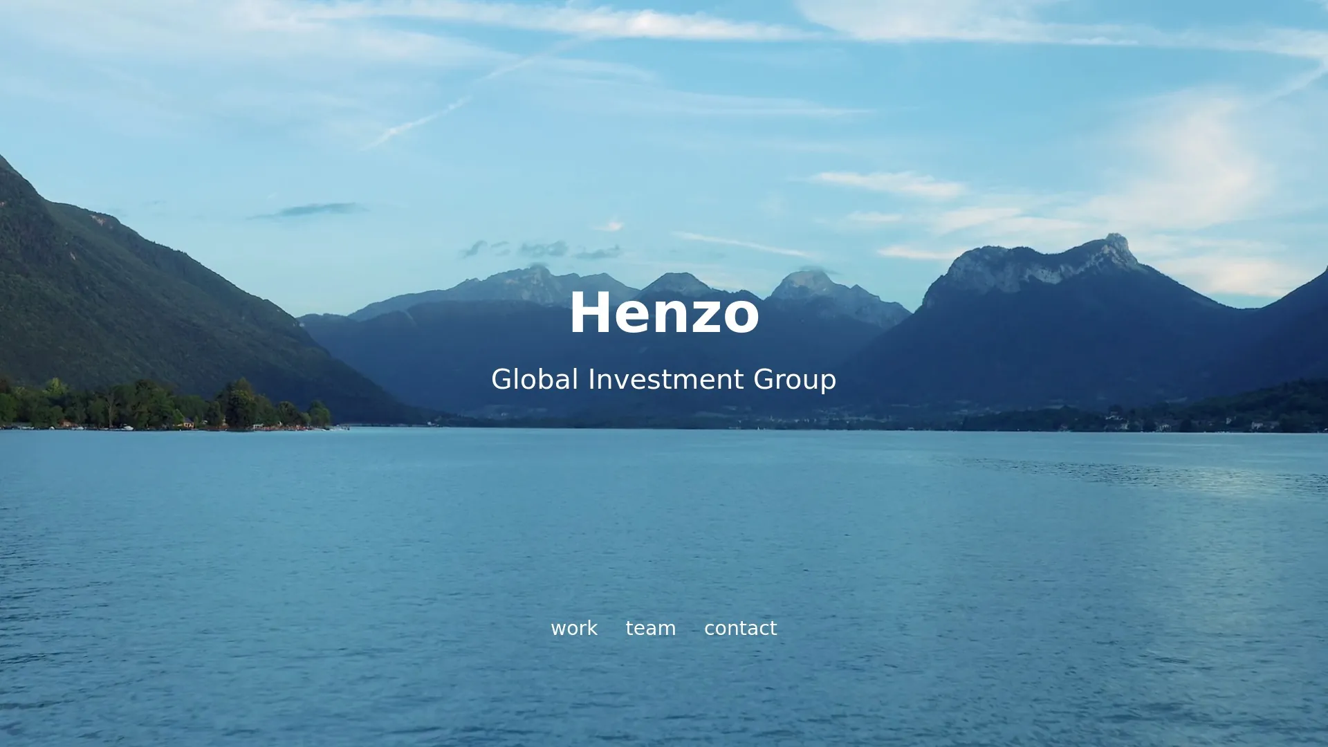 Henzo investment group website with an alpine lake and mountain landscape